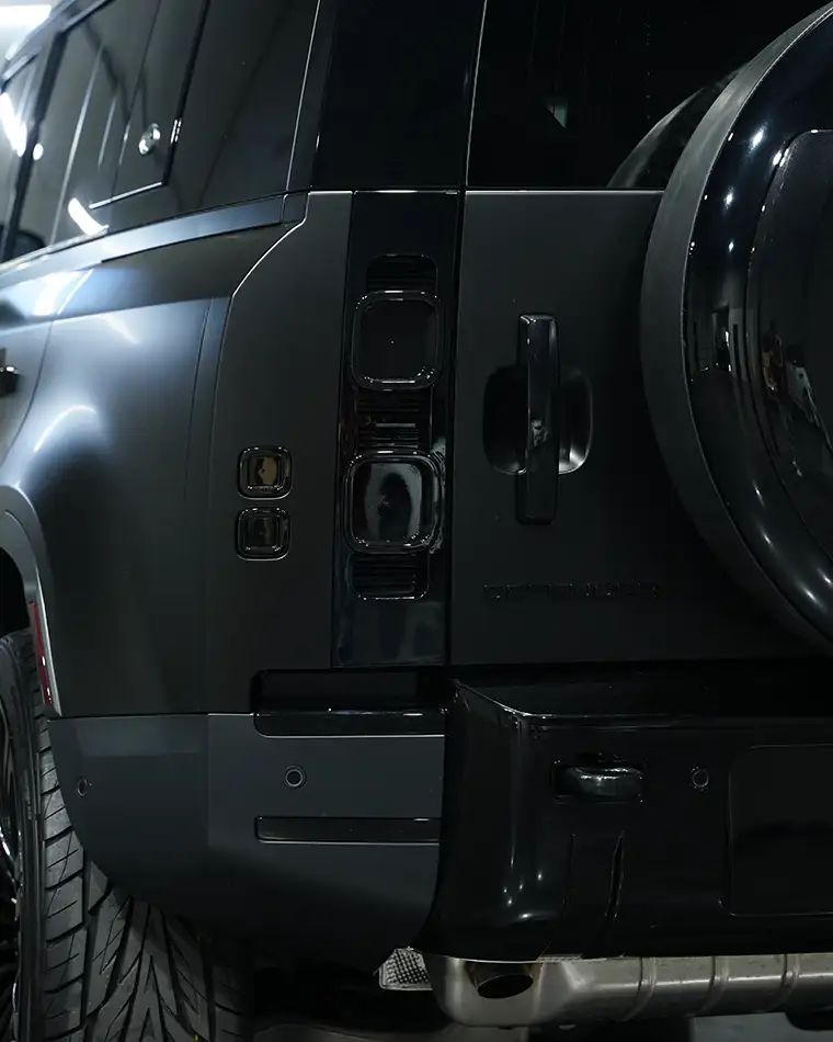 Blacked out trim and grille detail on a customized luxury SUV