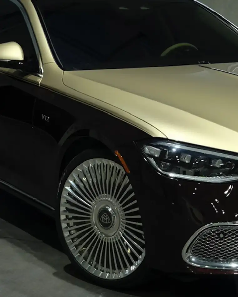 Color change vinyl wrap applied to a luxury coupe